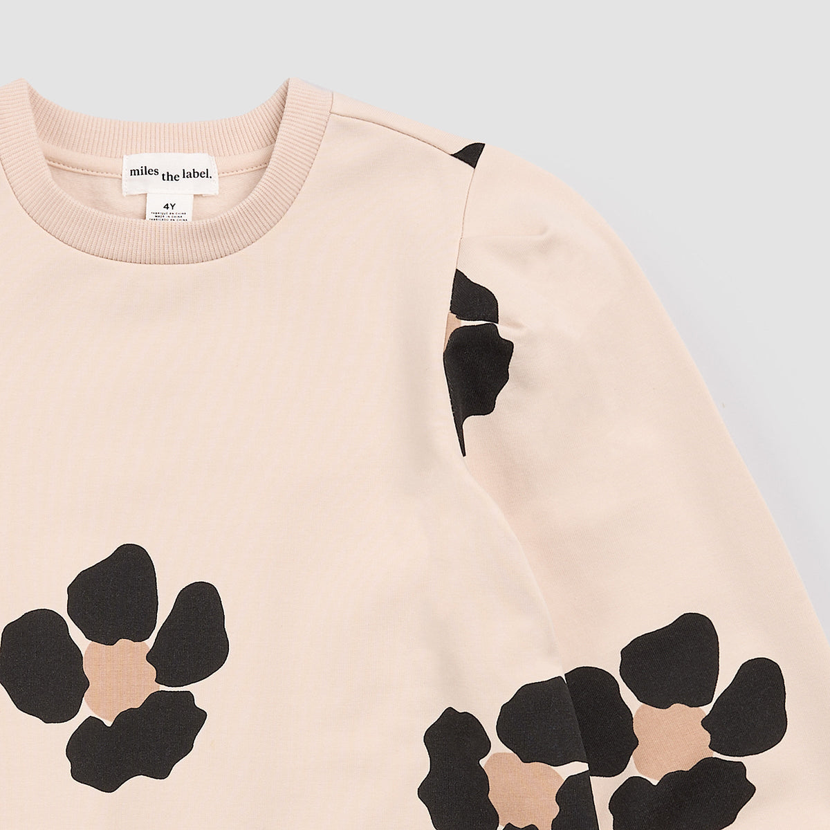 Bold Flower Print on Almond Fleece Sweater Dress detail